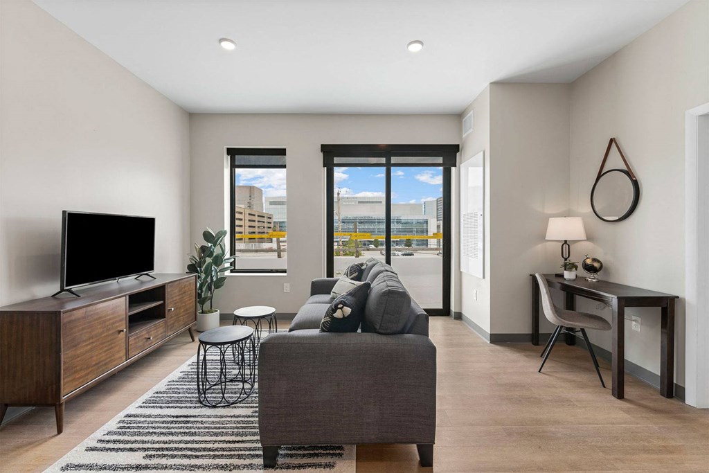 a living room with a couch and a tv