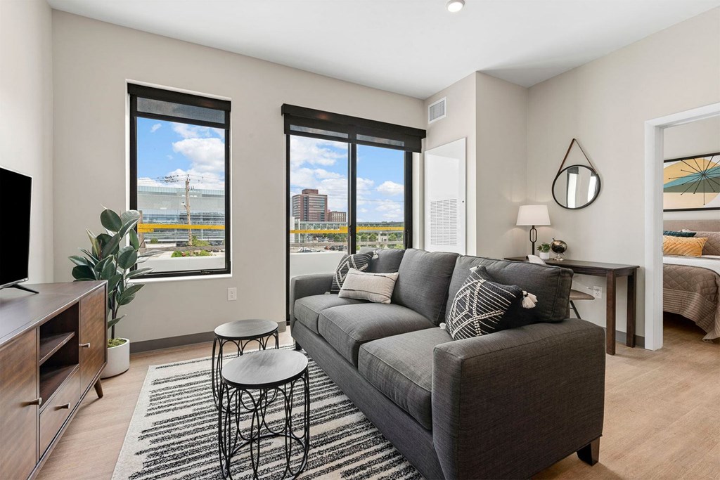 a living room with a couch and two tables
