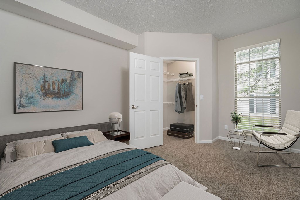 a bedroom with a bed and a closet