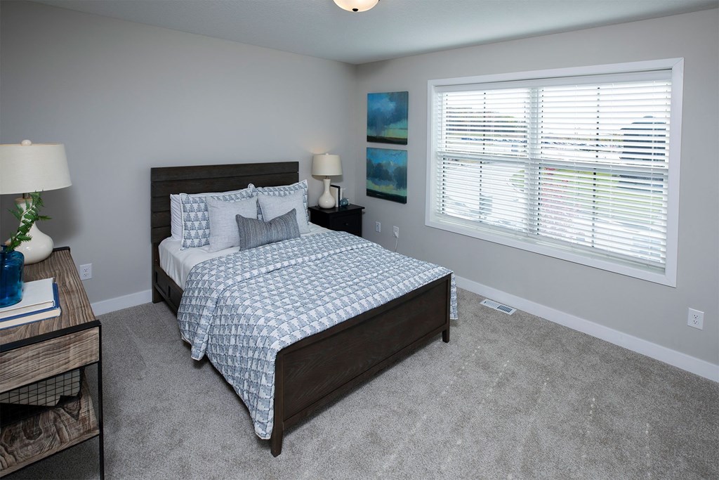 a bedroom with a bed in a room