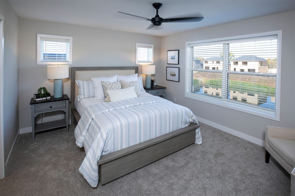 a bedroom with a bed in a room