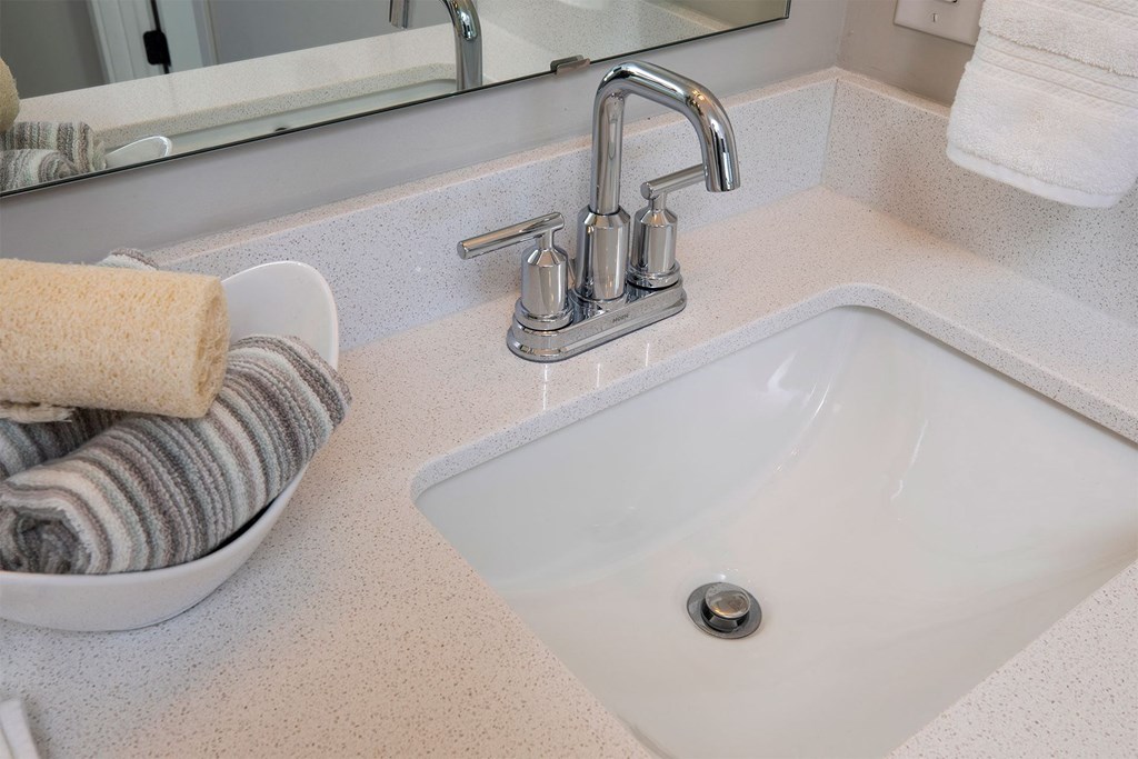 a bathroom sink with a chrome faucet