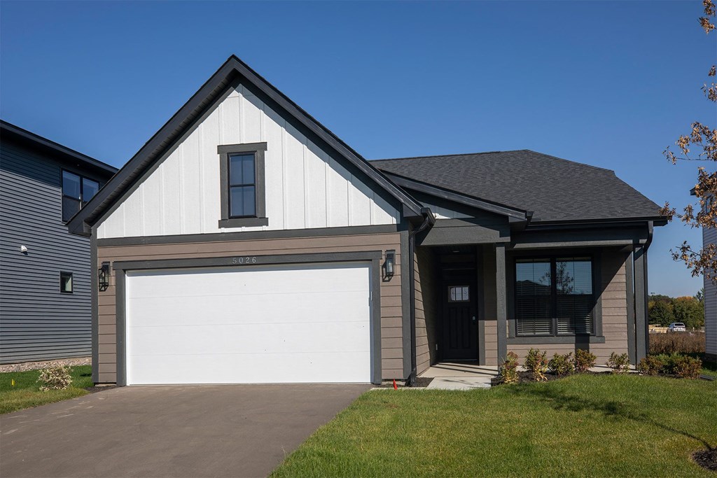 a house with a white garage door