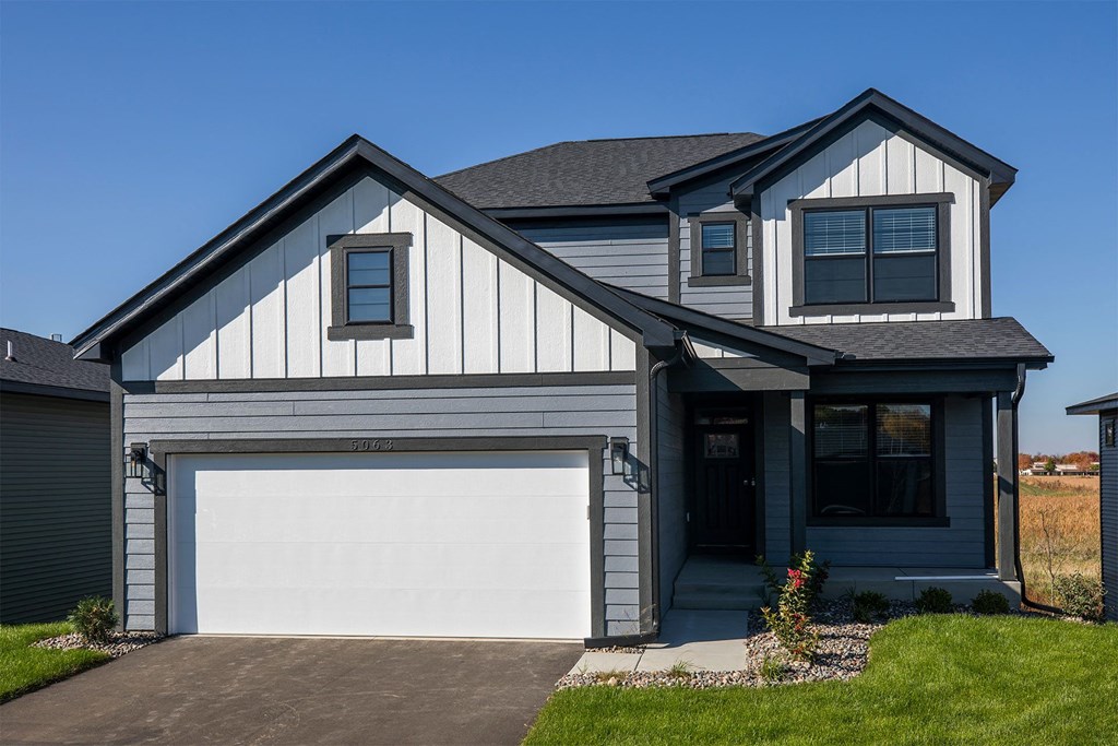 a house with a white garage door