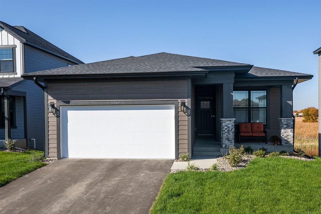 a house with a white garage door