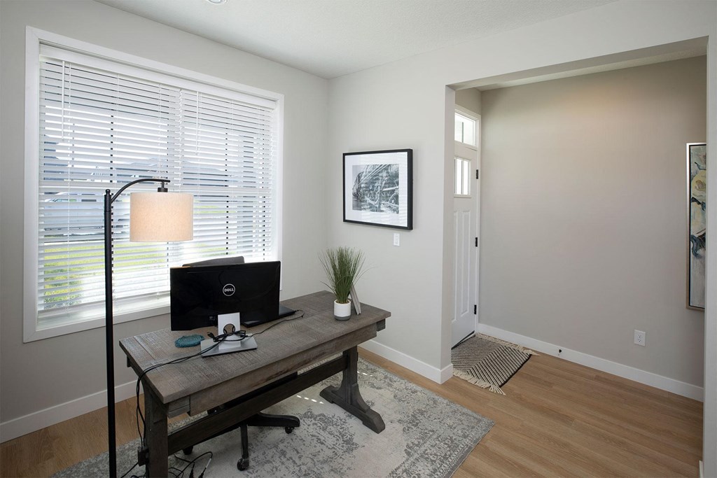 a home office with a desk and a computer