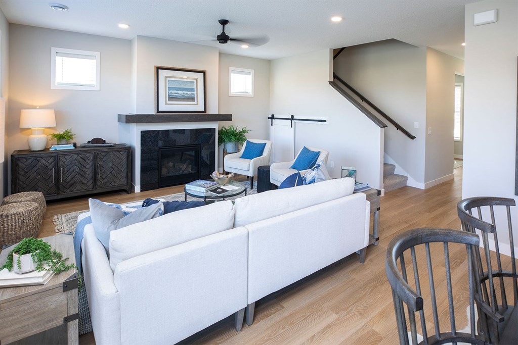 a living room filled with furniture and a fireplace