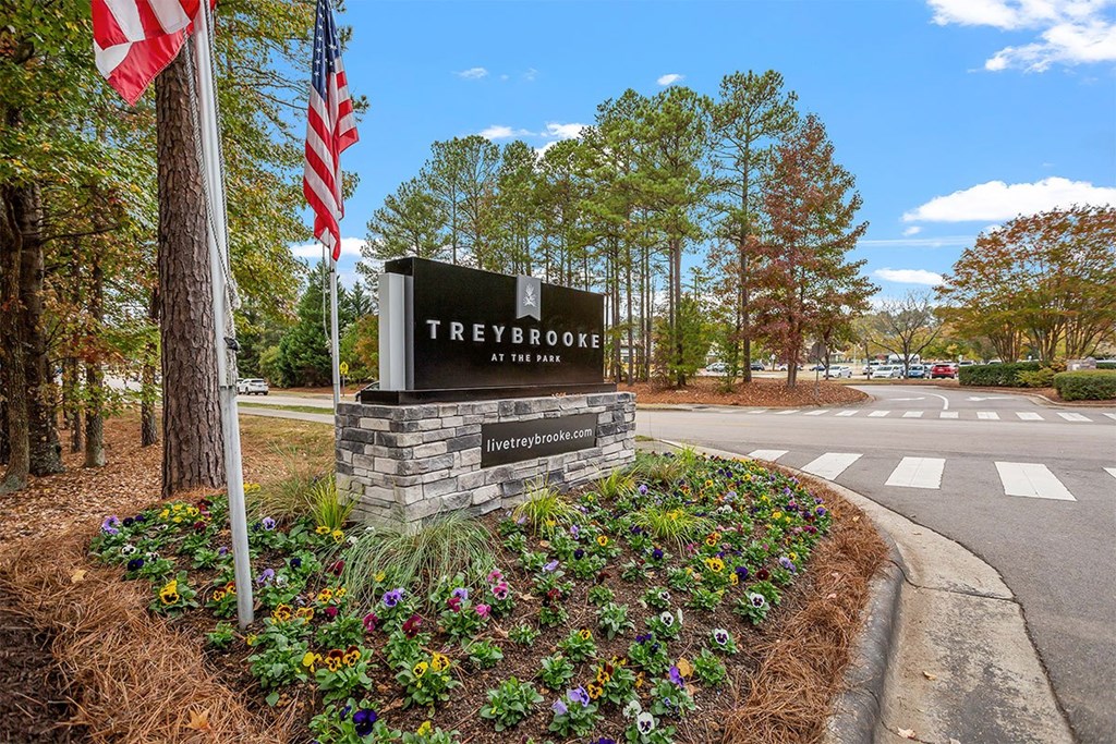 A sign for Treybrooke at the entrance of a suburban area.