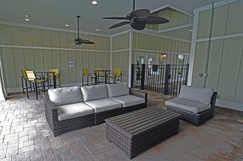vinings at carolina bays apartments outdoor covered lounge area - Photo Gallery 13