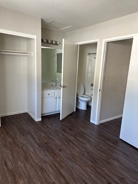 an empty bathroom with a toilet and a sink