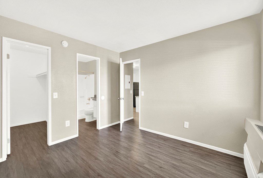 A room with three mirrors on the wall.