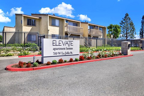 The image shows a sign for Elevate Apartment Homes at 700 W La Jolla St.