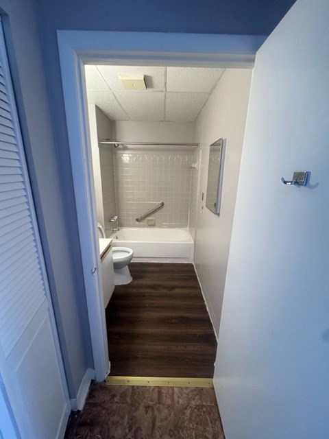 Representative Peabody Unit 304 bathroom with a bathtub and shower.