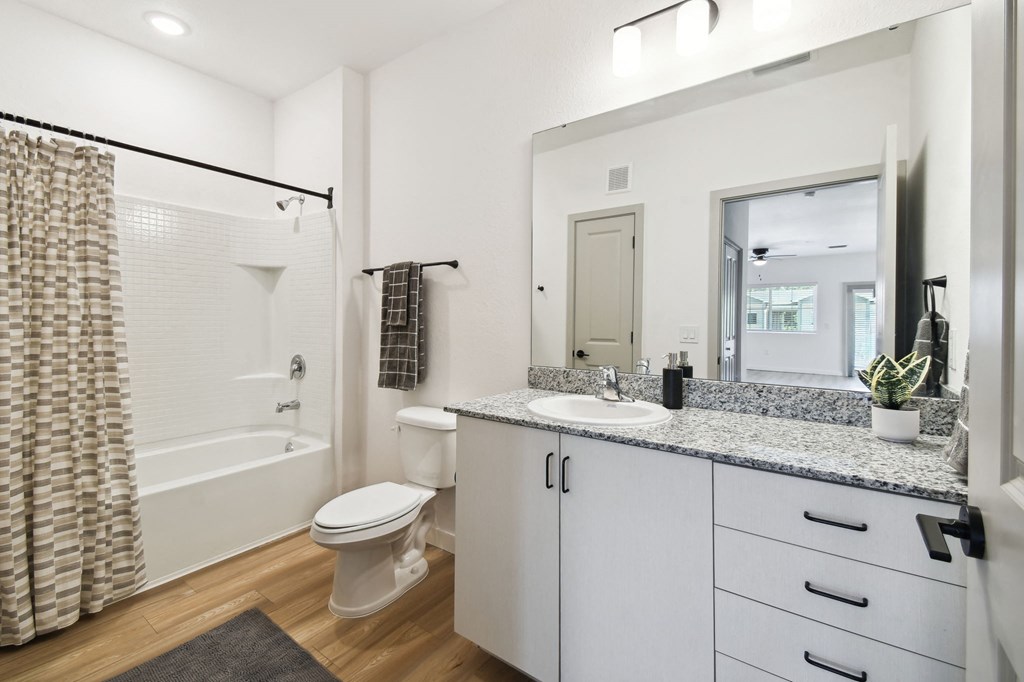 a bathroom with a shower toilet and sink and a mirror at Gibson Oaks, Lakeland, 33809