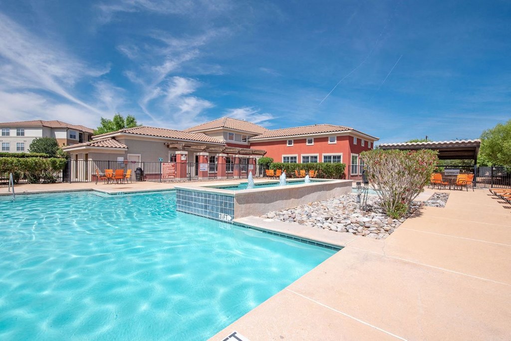 sparkiling pool with fountains and landscaping