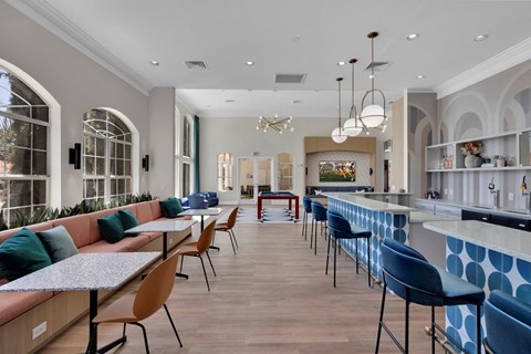 Clubhouse with tables and chairs and a bar