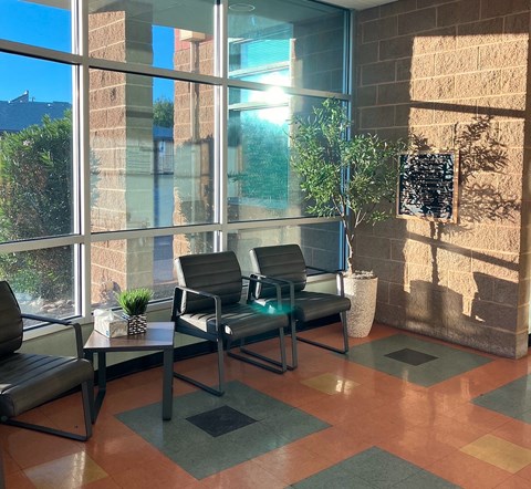 A sunny day at the office with a view of the sky through the windows.