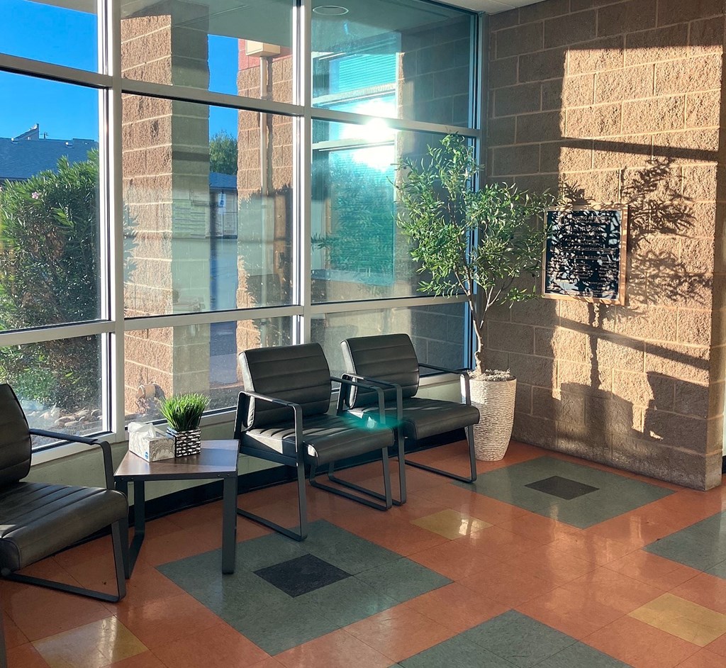 A sunny day at the office with a view of the sky through the windows.