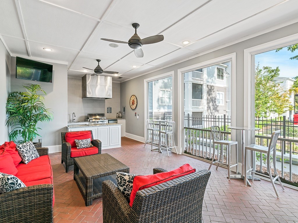 A patio with a table and chairs.
