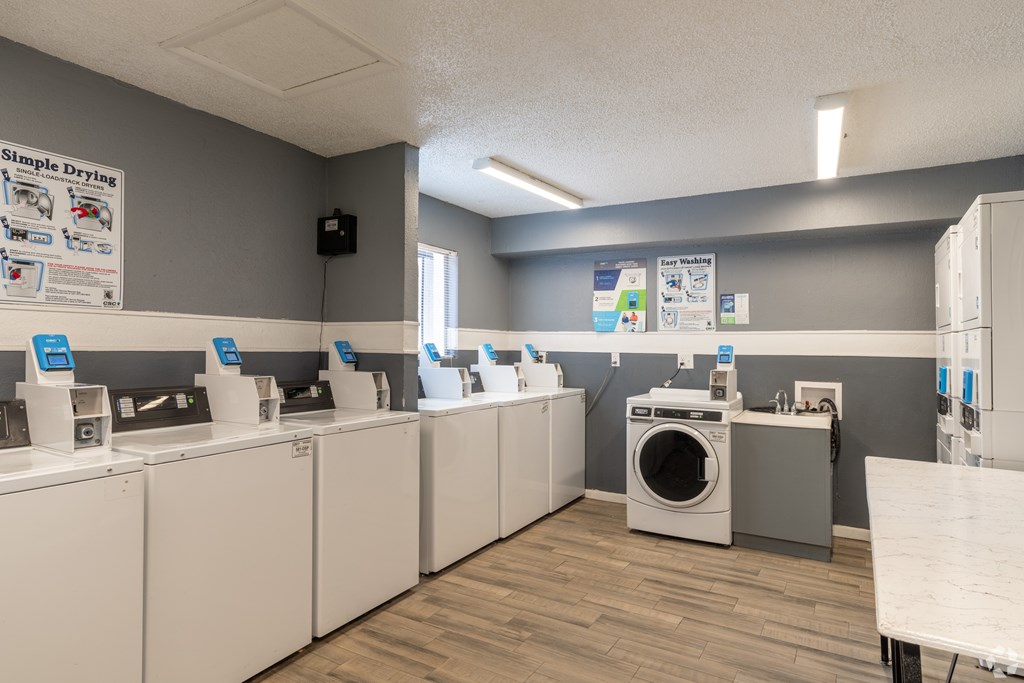 A laundromat with washers and dryers.