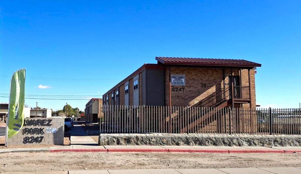 A small building with a sign that reads "MAREZ PARK" is surrounded by a black fence.