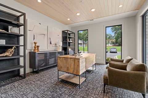 A modern living room with a wooden coffee table and a large window.
