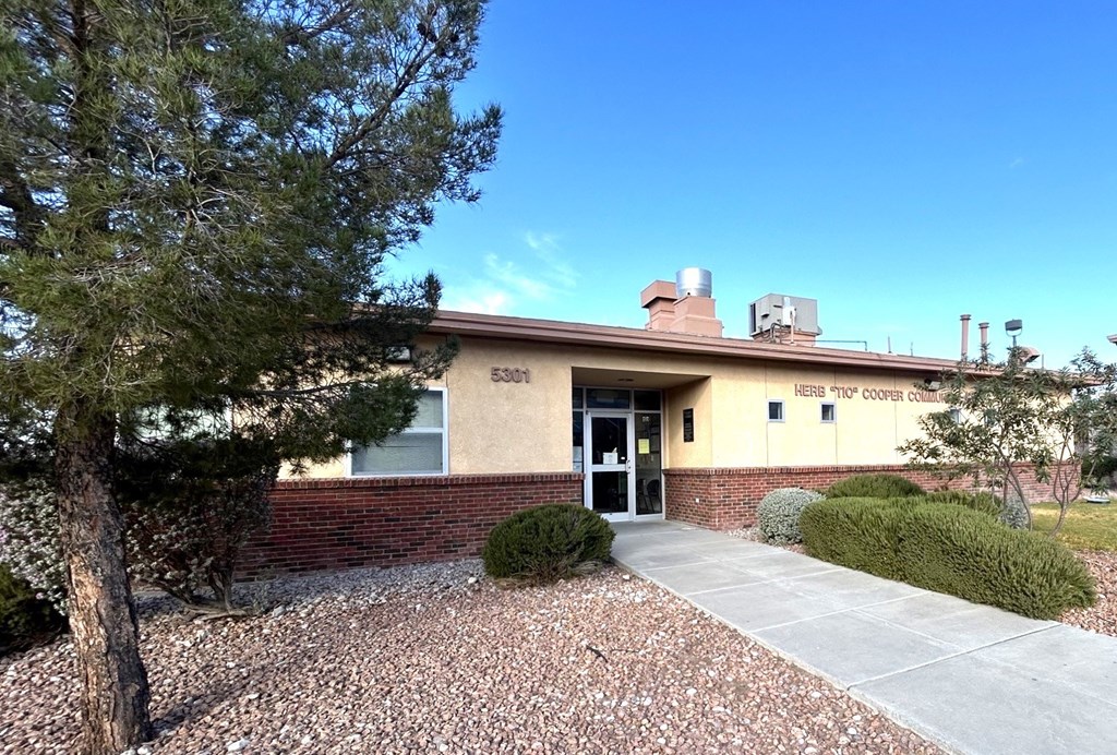 A building with a sign that says "HEARTH & TOILET CO." on it.