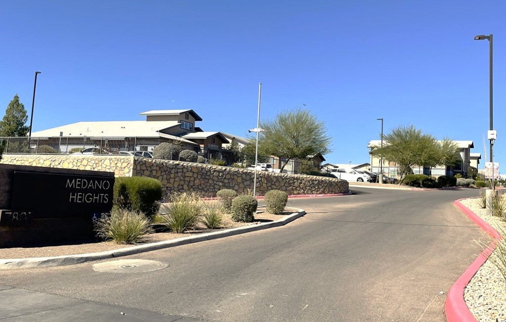 A street view of Medano Heights with a building in the background.