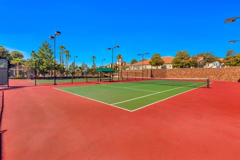 the tennis court is clean and ready for players to play