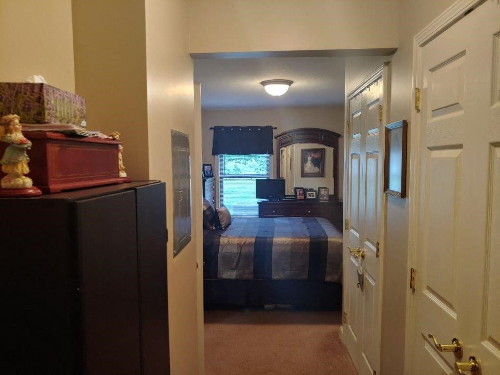 a bedroom with a bed and a closet