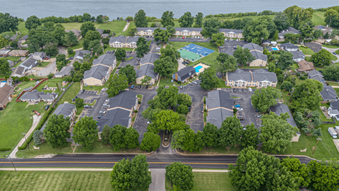 an aerial view of a neighborhood with houses and a pool
