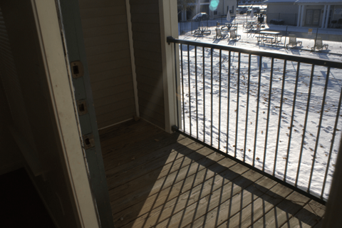 the view of the balcony from the front door of the house
