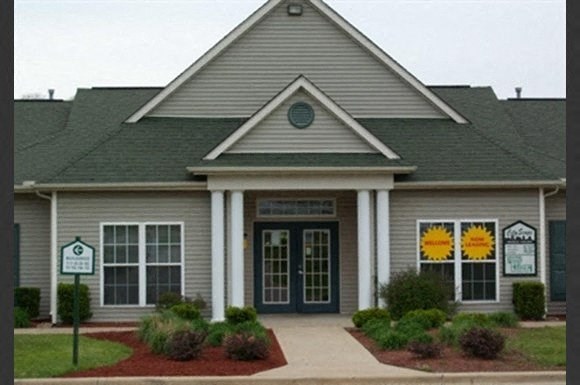 a house with a sign in front of it
