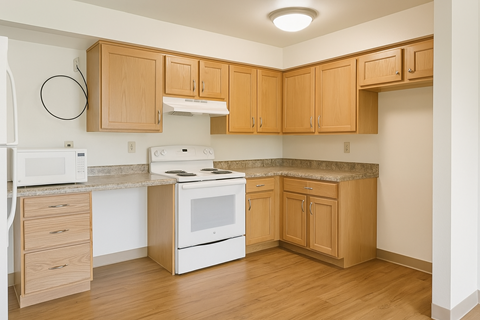 A kitchen with wooden cabinets and white appliances.