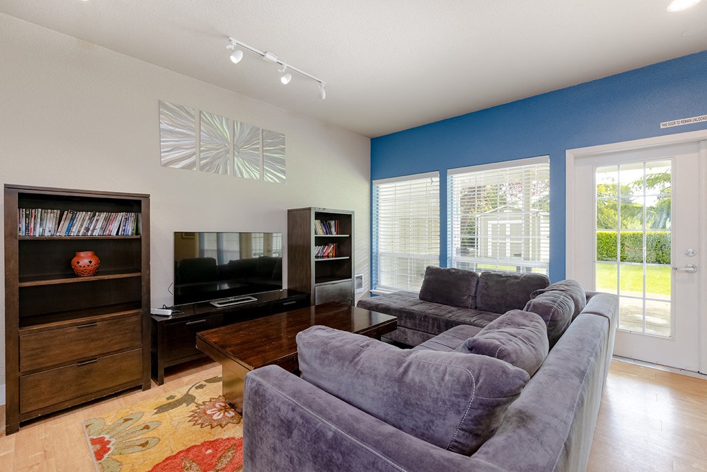a living room with a couch and a tv