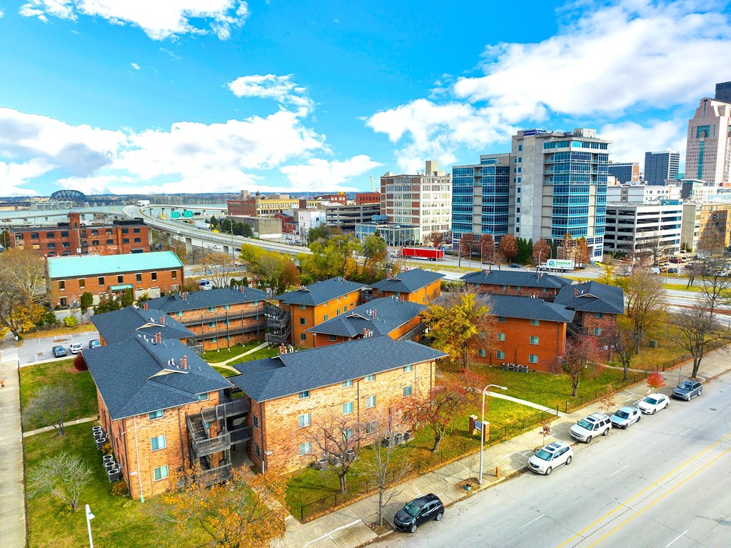 an aerial view of a neighbourhood with a city in the background