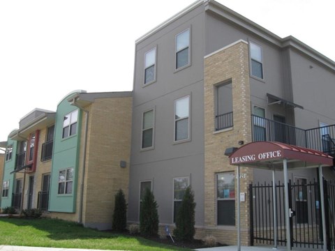 A multi-story building with a leasing office on the ground floor.