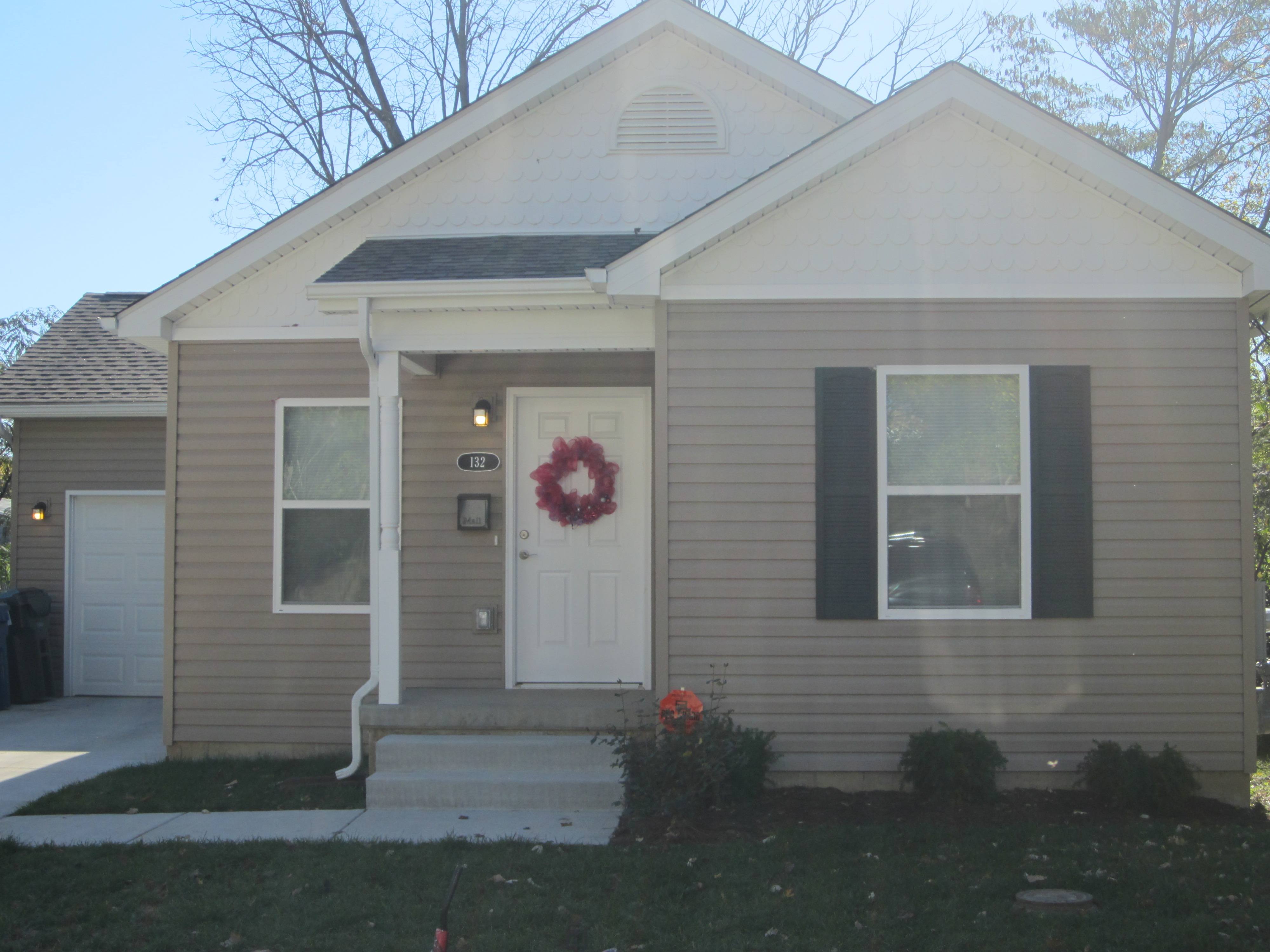 A house with a wreath on the door.