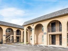 A building with arched windows and doors is shown.