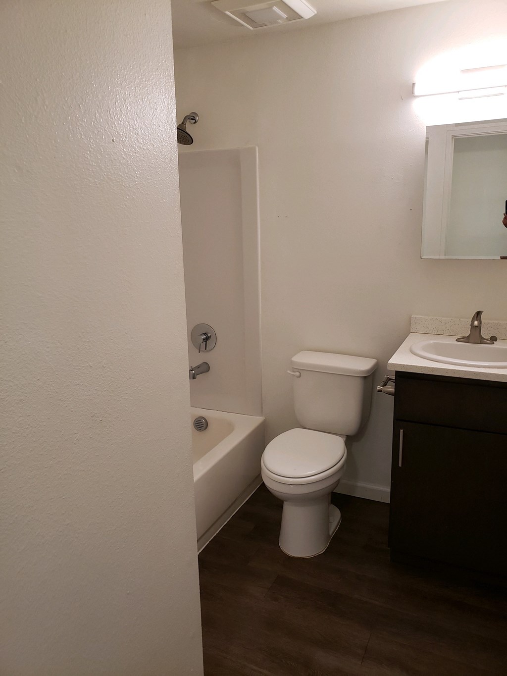 an empty bathroom with a toilet and a sink