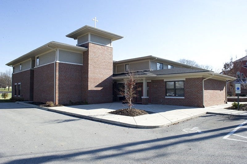 a church building with a cross on top of it