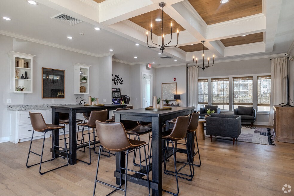 a living room with a bar and a dining room