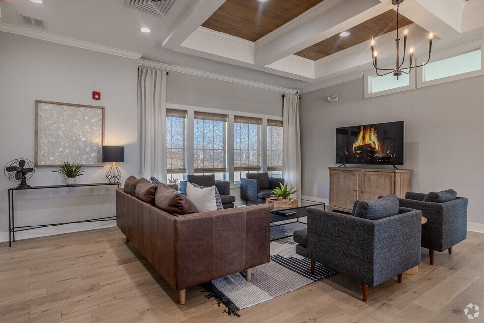 a living room with couches and a fireplace