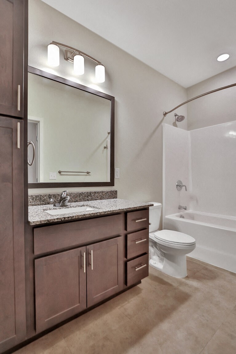 a bathroom with a sink toilet and bathtub