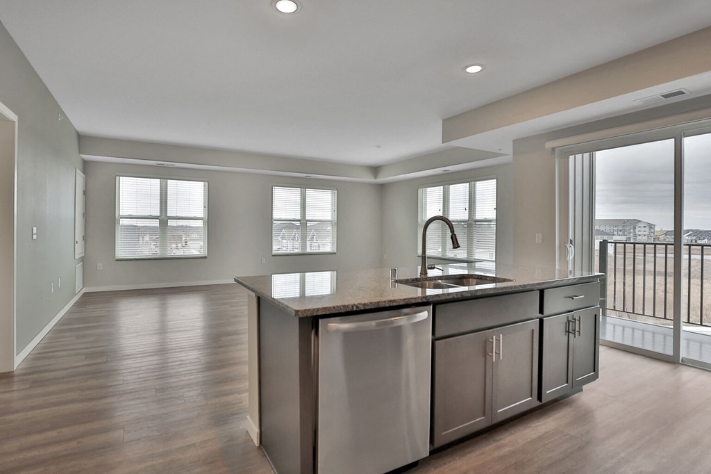 a kitchen and living room with a view of the city