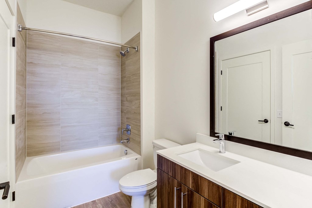 a bathroom with a toilet sink and bathtub