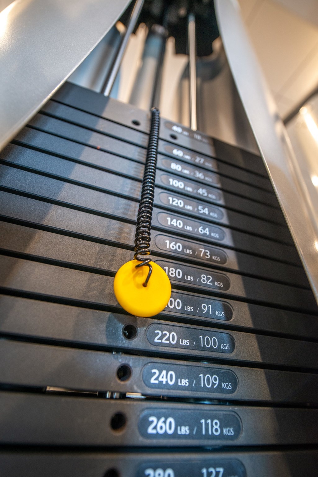 an escalator with a yellow button on it