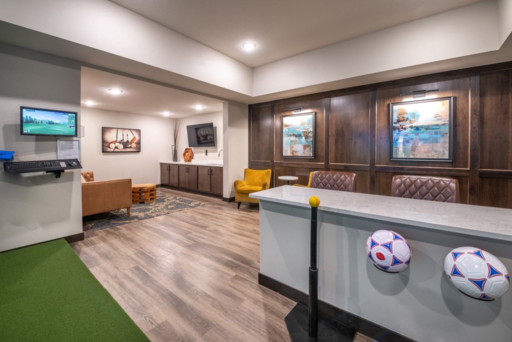 a game room with a pool table and a soccer ball