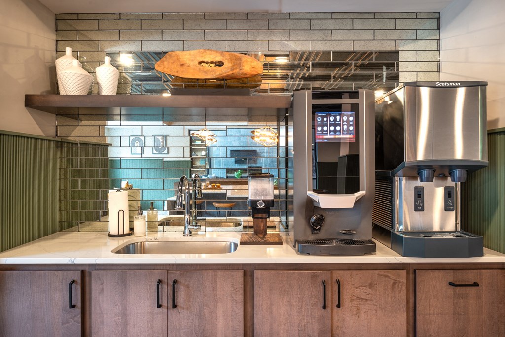 a kitchen with a coffee machine and a sink