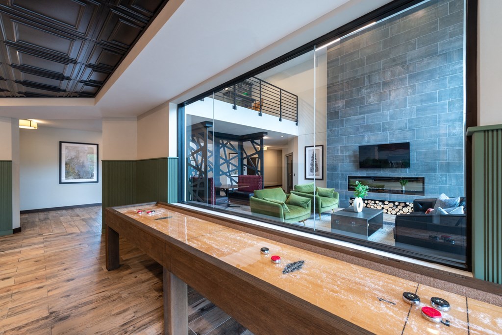 a large mirror in a living room with a pool table